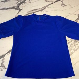 This is a women’s small blouse that is a gorgeous royal blue!